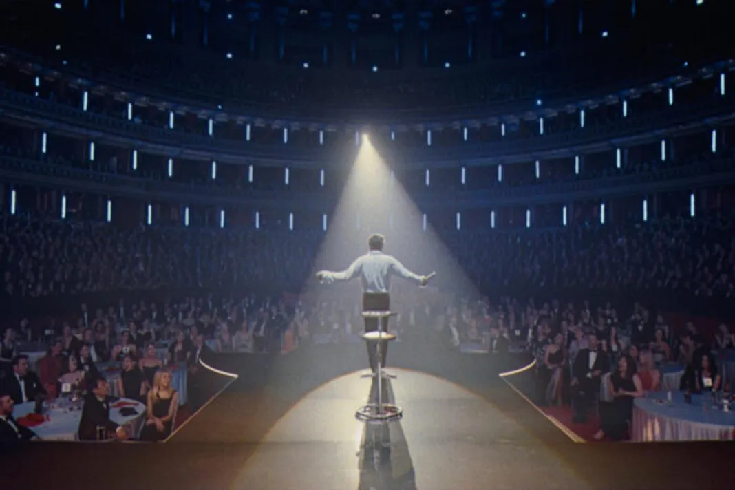 © Jonno Davies and Robbie Williams as 