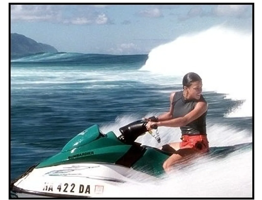 Blue Crush movie still: Eden (Michelle Rodriguez) is chased by a monster waves as she rides out to rescue Anne Marie