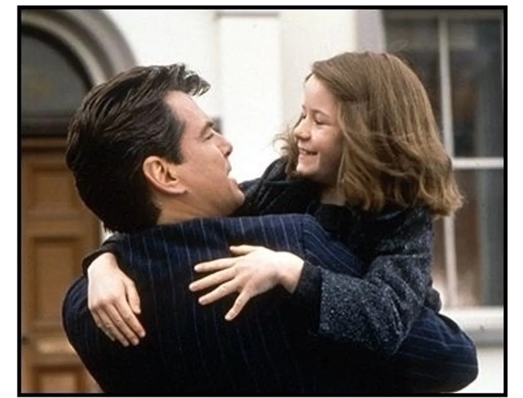 Evelyn movie still: Desmond Doyle (Pierce Brosnan) shares a happy moment with his daughter, Evelyn (Sophia Vavasseur) in Evelyn
