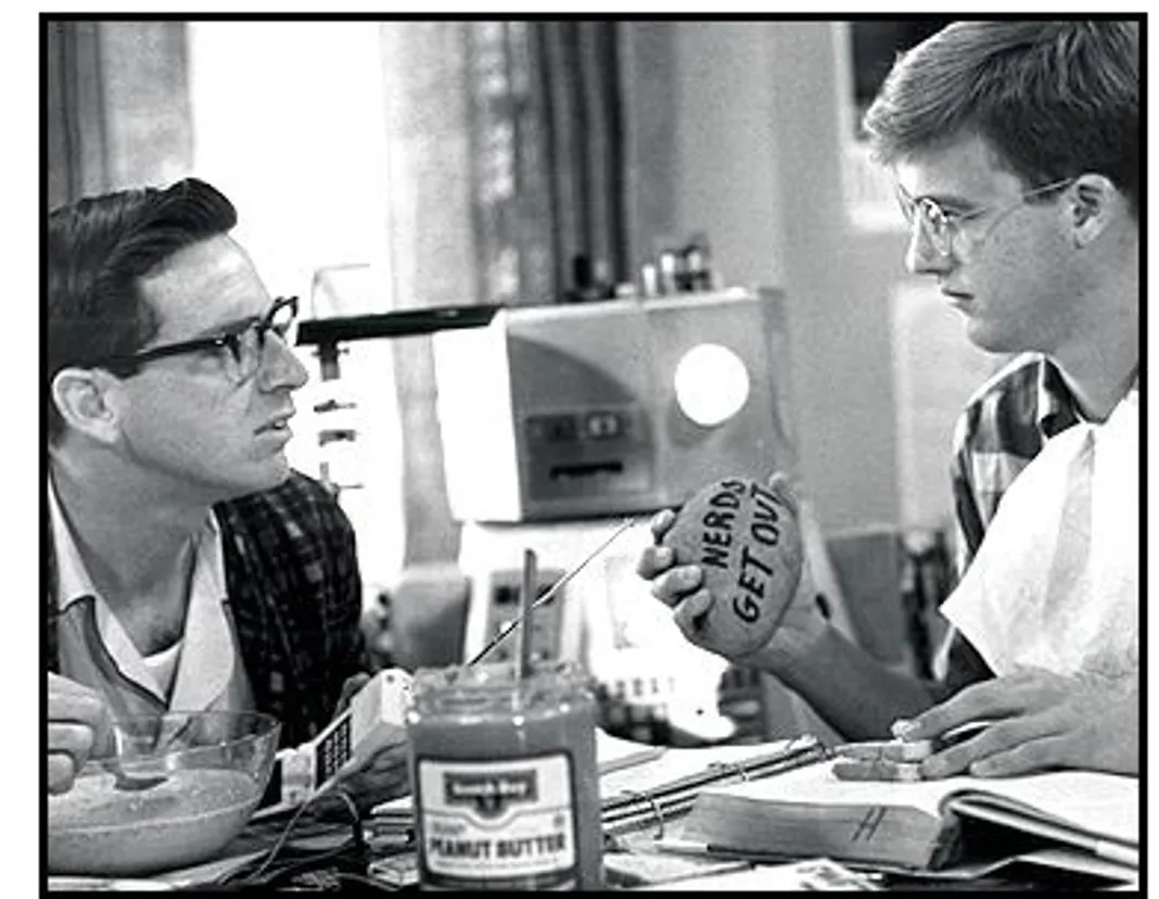 Revenge of the Nerds movie still: Lewis (Robert Carradine, left) and gilbert (Anthony Edwards, right) recieve a sinister warning in Revenge of the Nerds movie still: Lewis (Robert Carradine, left) and gilbert (Anthony Edwards, right) recieve a sinister warning in