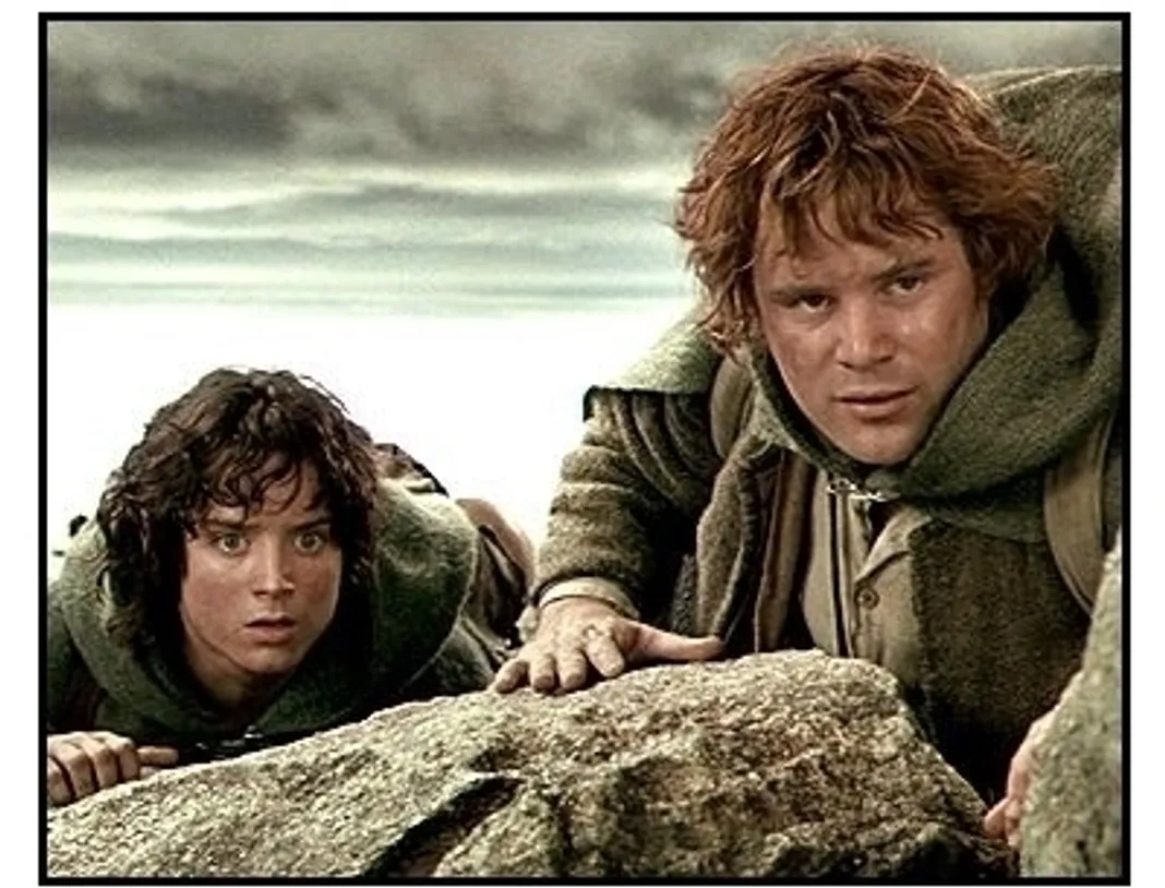 The Lord of the Rings: The Two Towers movie still: Frodo (Elijah Wood) and Sam (Sean Astin) cautiously approach the black gates of Mordor in The Lord of the Rings: The Two Towers