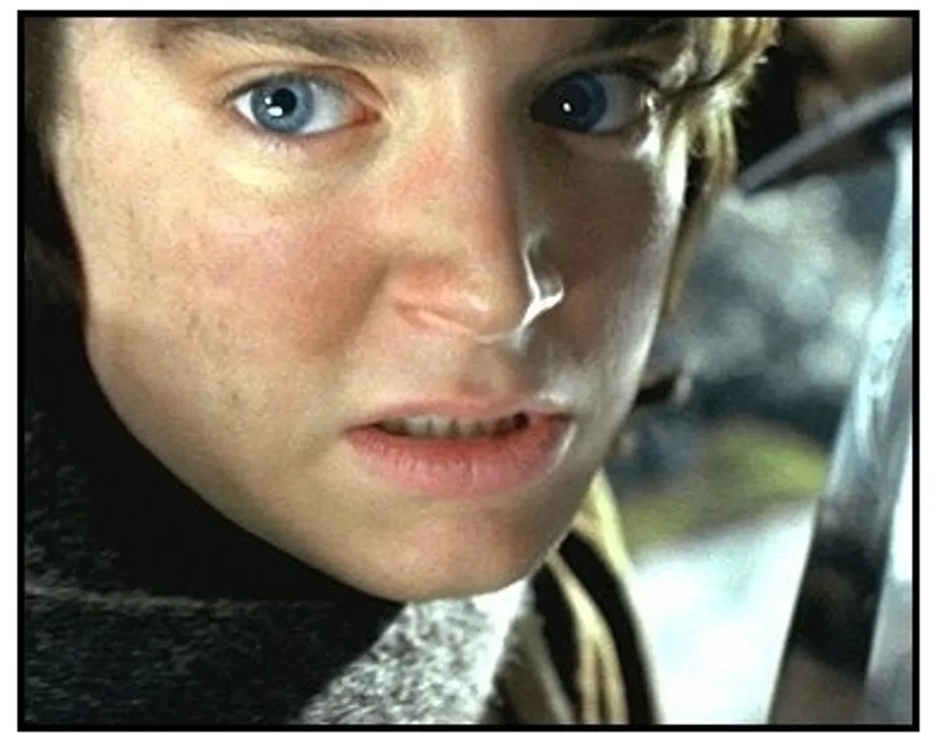 The Lord of the Rings: The Two Towers movie still: Frodo (Elijah Wood) prepares to strike with his sword, Sting in The Lord of the Rings: The Two Towers