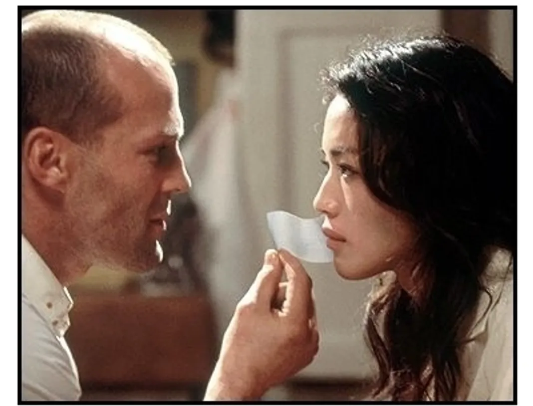 The Transporter movie still: Frank (Jason Statham) makes things a little more comfortable for his latest package, Lai (Shu Qi) in 